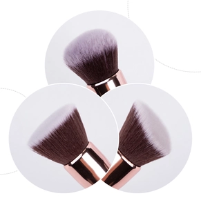 Detail of two-tone synthetic makeup brush bristles with a rose gold metal ferrule