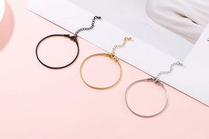 Detailed view of 18K gold plated stainless steel snake chains in black, gold, and silver