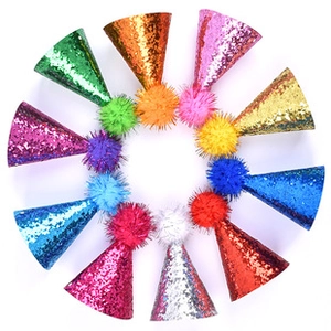 Macro display of colorful sequin party hats for pets with vibrant pompoms in various colors