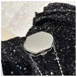 Octagonal silver mirror evening bag with metallic ball chain on black sequin fabric