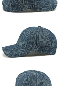 Detail view of navy denim baseball cap with white wave embroidery and metal buckle