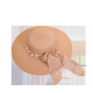 Women's summer straw sun hat with wide brim, floral pearl band and large bow detail
