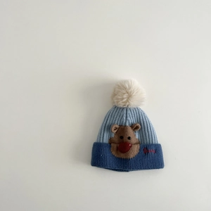 Detail of baby knit hat featuring brown deer embroidery and red Sunny text on blue knit