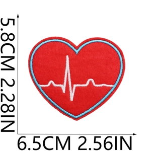 Detail view of heart-shaped embroidery patch with ECG wave and dimension labels