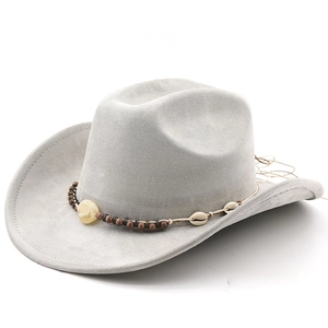 Detail of grey suede cowboy hat featuring tribal beads and genuine shell band decoration