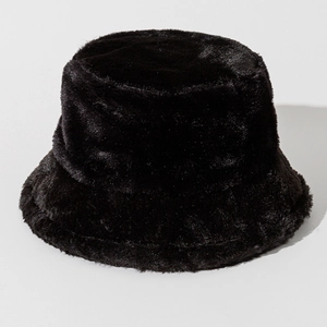 Detailed view of the dense black faux fur texture on a warm winter bucket hat