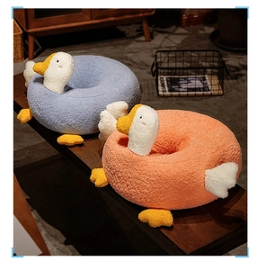 Detailed view of soft textured goose shaped plush seat cushions in blue and pink colors
