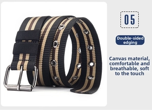 Detail of striped canvas belt with metal grommets and durable silver pin buckle