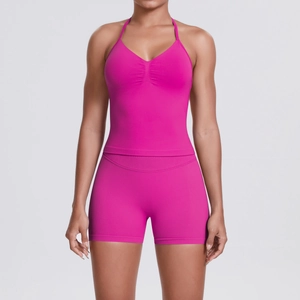Detail of rose red yoga set with halter neck sports bra and high waist compression shorts