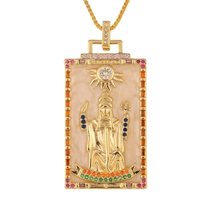 Macro view of gold Hierophant tarot pendant with colorful gems and enamel detail