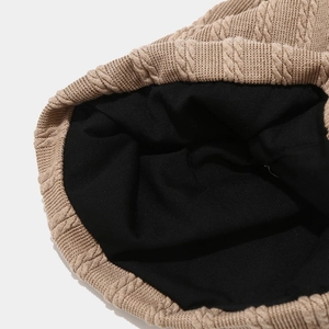Chic camel cable knit beanie with warm black fleece lining for autumn and winter comfort