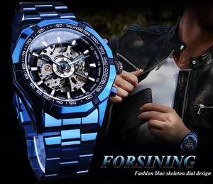 Detail of blue skeleton dial automatic watch with model wearing metal strap timepiece