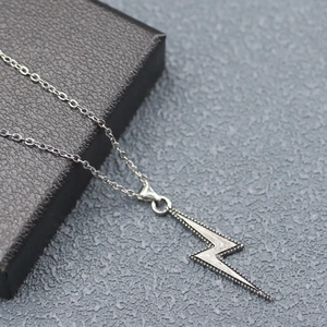 Luminous lightning pendant necklace in stainless steel on a black gift box