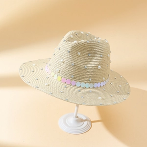 Fashionable straw sun hat with pearls and rhinestones on wide brim for outdoor women