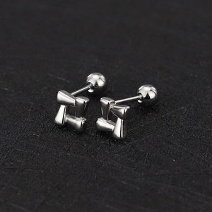 Detail of silver geometric square knot stud earrings with secure screw back closure