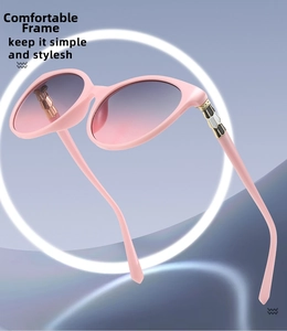 Close-up of pink sunglasses featuring gradient lenses and snake bone temple accents