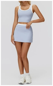 Detail of light blue racerback tank top and matching tennis skirt with white trim