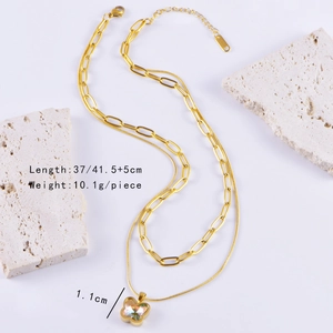 Detail view of gold double layer butterfly necklace with length and weight measurements
