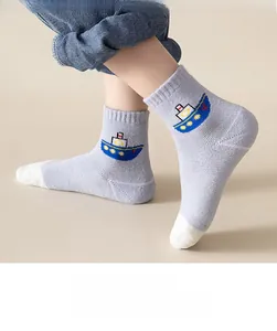 Detail of warm cotton baby socks featuring colorful cartoon ship and contrast toe