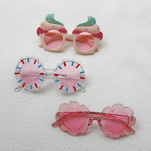 Set of three pink fashion sunglasses for kids featuring flower and ice cream shapes