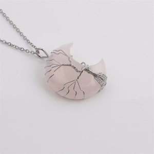 Minimalist silver moon pendant necklace with pink crystal and tree of life wire wrapping