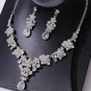 Detail of luxury bridal jewelry set with crystal teardrop necklace and earrings