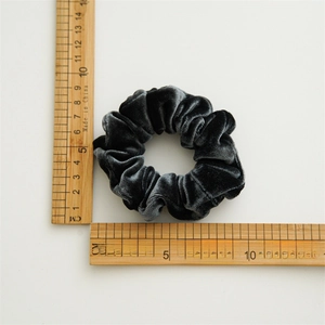 Dark grey velvet scrunchie hair tie measuring 10-11cm diameter on a white background