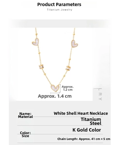 Detailed view of gold plated titanium steel heart necklace with white shell inlay