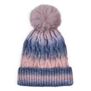 Detail of cable-knit texture and soft pom-pom on gradient color winter beanie hat