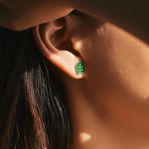 Elegant S925 sterling silver ear studs with green enamel plant badge and gold leaf design