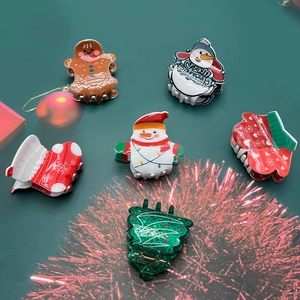 Set of 6 Christmas acrylic hair claws featuring gingerbread man, snowman and tree designs