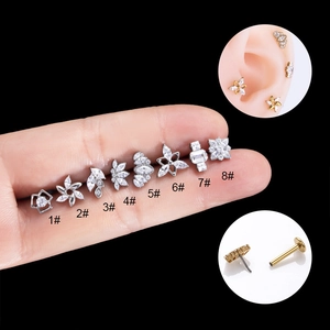 G23 titanium labret studs set with flower and star shapes featuring zircon stones