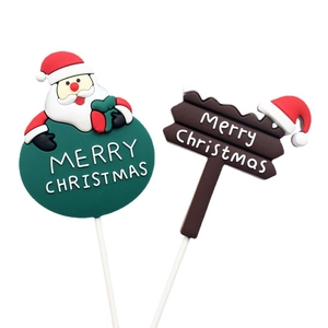 Soft rubber Christmas cake toppers featuring Santa Claus and brown wooden sign design