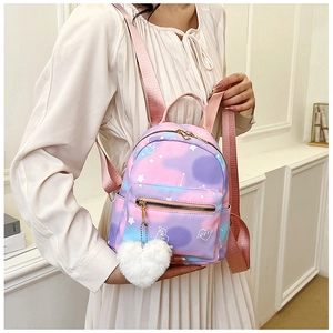 Mini gradient backpack detail with stars and plush heart charm on the front pocket