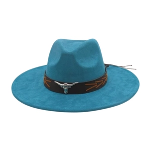 Detail of teal fedora hat featuring brown leather band and silver bull head emblem