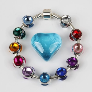 Colorful crystal beaded bracelet with faceted glass charms and a blue heart pendant