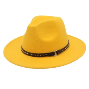 Detail of yellow fedora hat with black leather rivet band and silver metal ring accessory