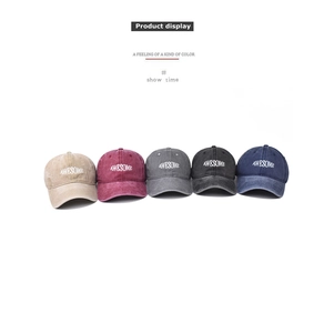Detailed display of vintage washed cotton baseball caps in five diverse colors