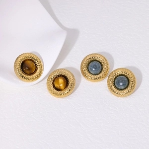 Vintage gold cat-eye stone stud earrings with hammered metal texture on white background