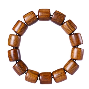 Round wooden bead bracelet made of 13 brown barrel beads with natural wood grain