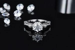 Macro detail of 1 carat moissanite ring with side accent diamonds and silver band