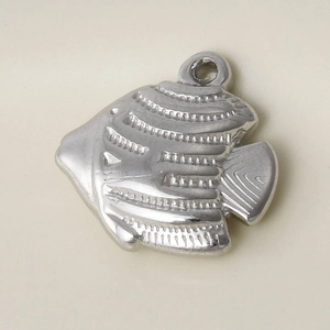 Close-up of a polished 304 stainless steel fish pendant with detailed texture and loop
