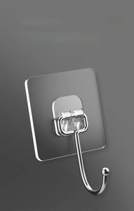 Close-up of transparent adhesive hook with sturdy metal U-shaped design for storage