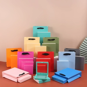 Colorful gift paper bags and matching drawer jewelry boxes in various sizes and vibrant shades
