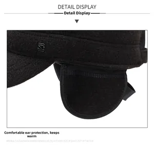 Detail of warm winter cap showing ear protection flaps and premium metal SD logo