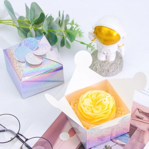 Holographic cube gift box with floral petal closure and shimmering laser finish effect