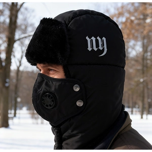 Detail of winter trapper hat with mask, breathing valve and faux fur lining for men