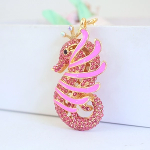 Sparkling pink rhinestone seahorse keychain with gold crown and enamel details