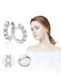 Detail of S925 sterling silver hoop earrings with prong-set moissanite stones
