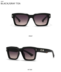 Close-up of black frame sunglasses with gray tea gradient lenses and metal rivet details
